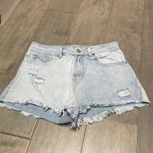 Blue and white striped, ripped jean shorts. Size 7 for juniors.